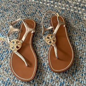 Tory Butch gold metalic thong sandals with rhinestone logo